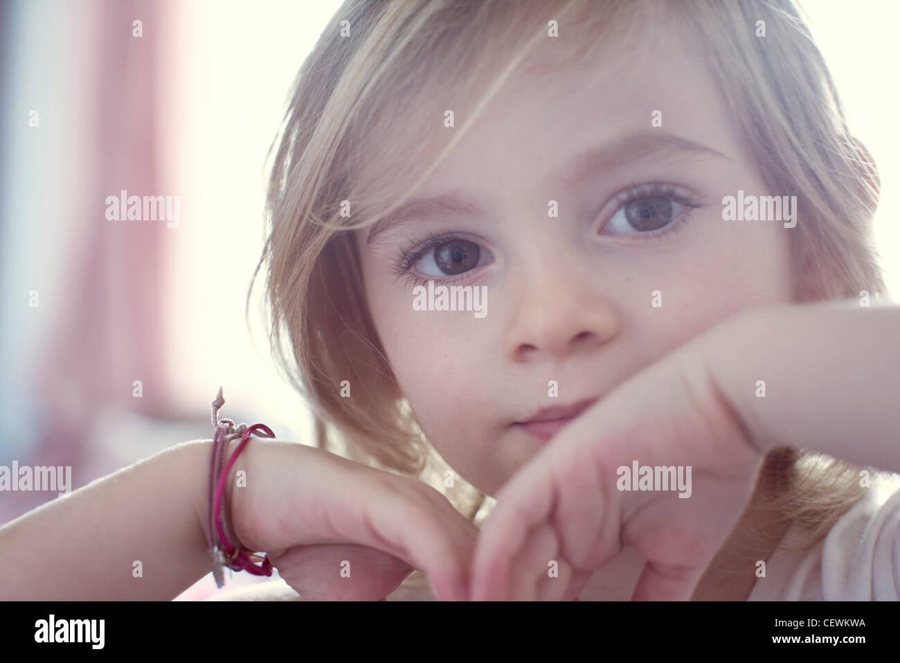 Little girl looking at camera, portrait Stock Photo - Alamy