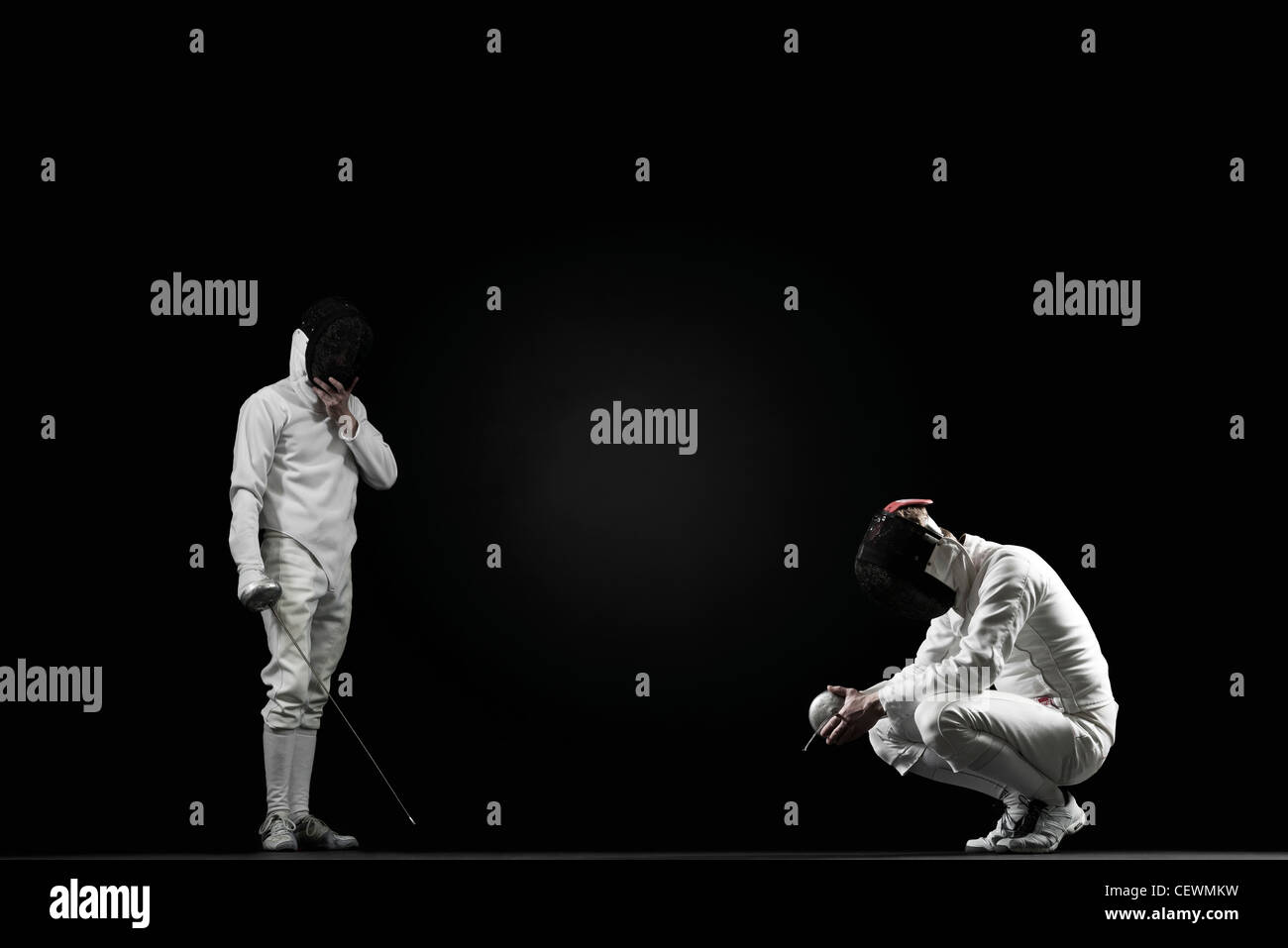 Winning fencer and defeated fencer Stock Photo