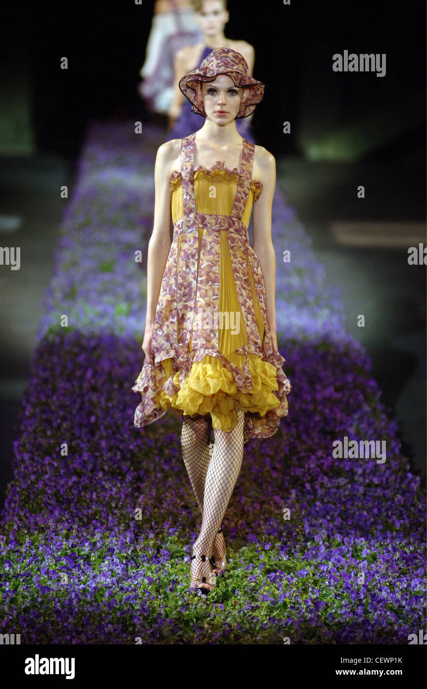 Female model wearing a floral and pleated mustard yellow dress ruffled ...