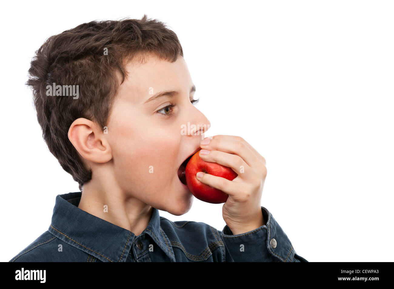 Closeup of a boy eating a red apple isolated on white background Stock ...