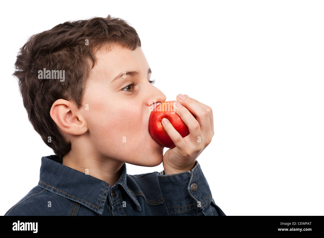 Closeup of a boy eating a red apple isolated on white background Stock ...