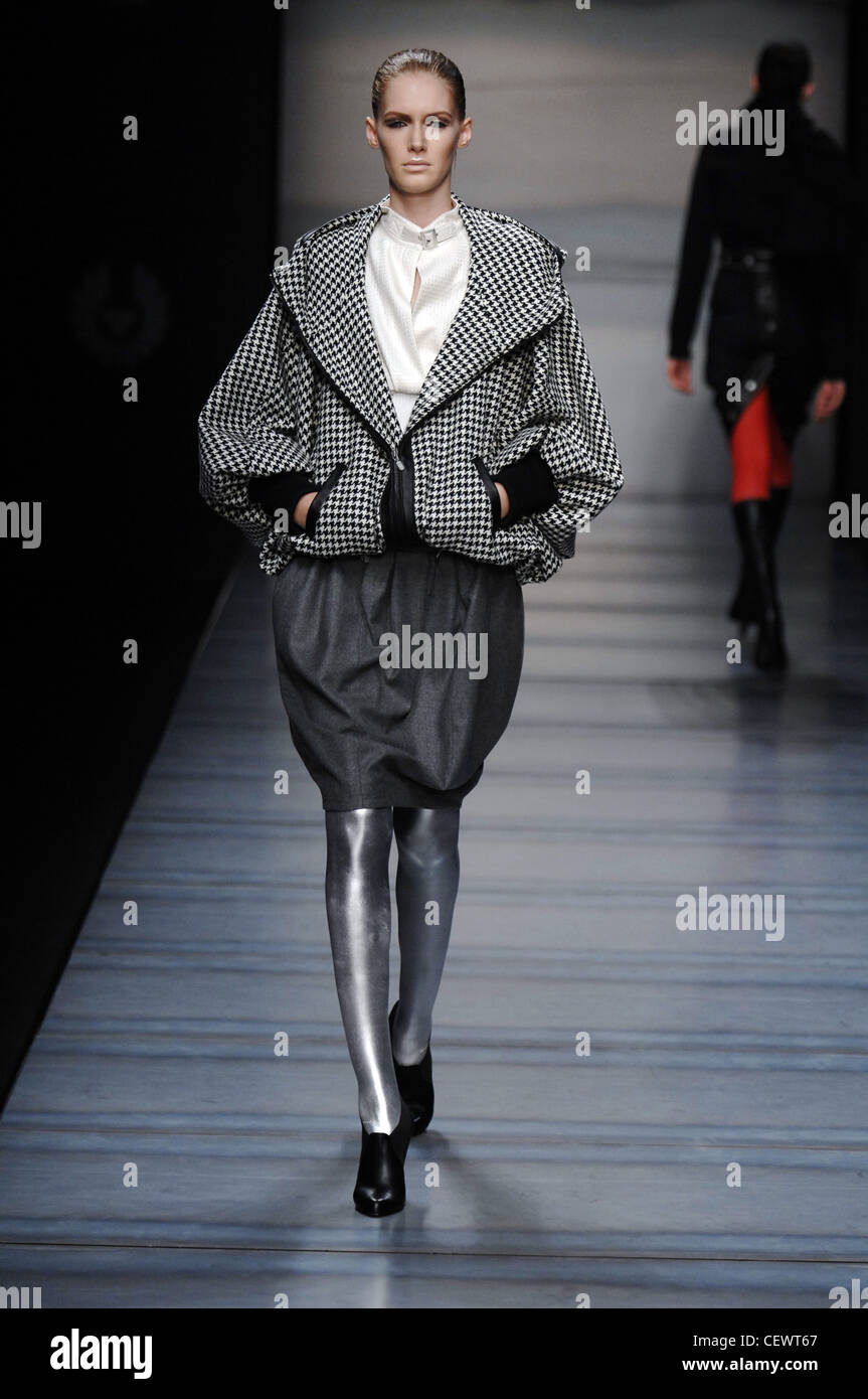 Belstaff Milan Fashion Week Autumn Winter Model wearing dark grey tulip shaped skirt, white blouse open front and buckle Stock Photo