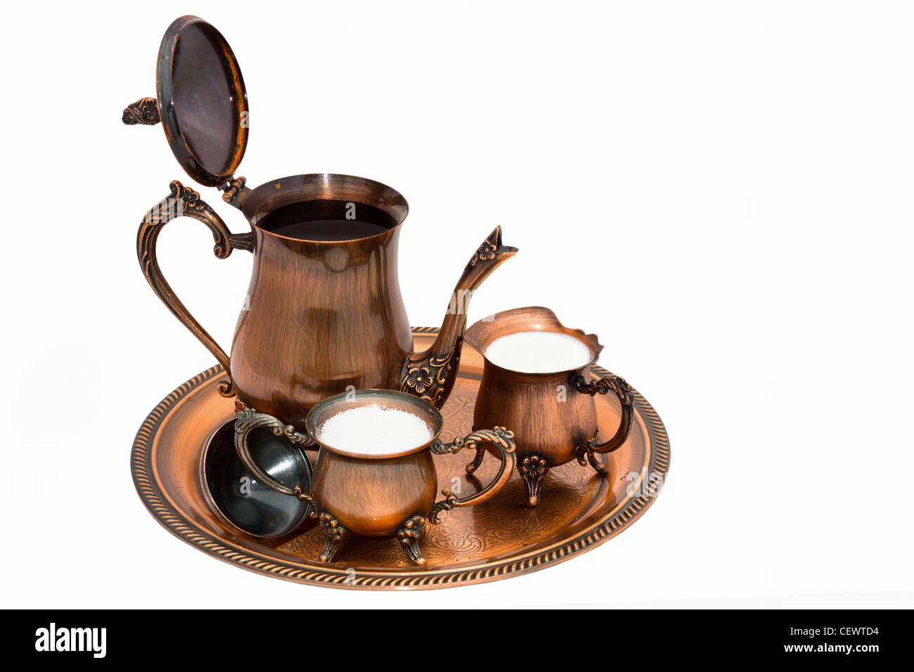 Evening with coffee. Copper coffee set. Retro style. Stock Photo