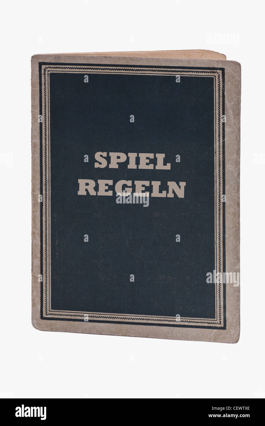 Detailansicht eines Buches mit der Aufschrift 'Spielregeln' | Detail photo of a book with the German title 'Spielregeln' Stock Photo