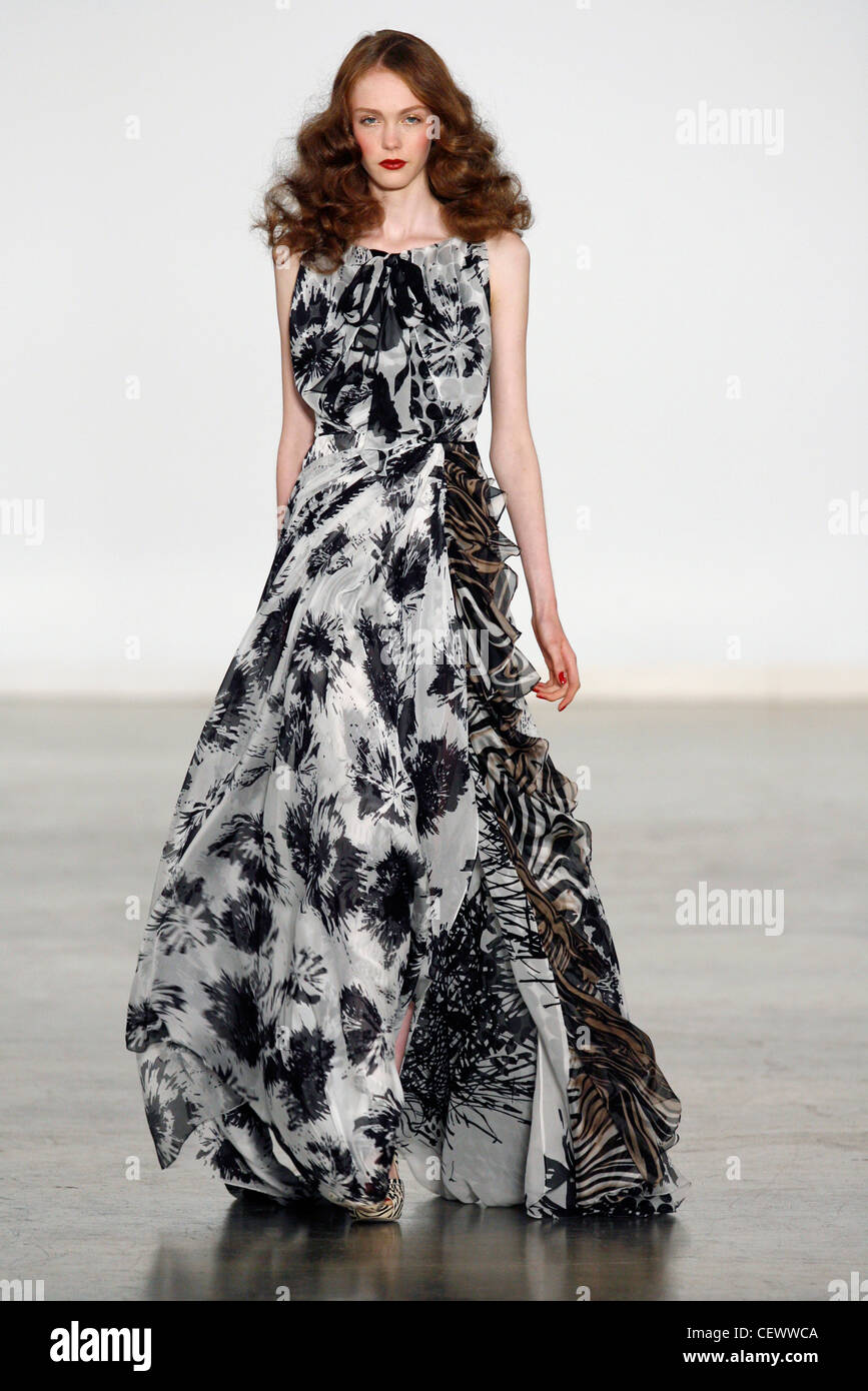 Tuleh New York Ready to Wear Spring Summer Glamorous tie and dye effect monochrome print flowing gown with ruffled detail Stock Photo