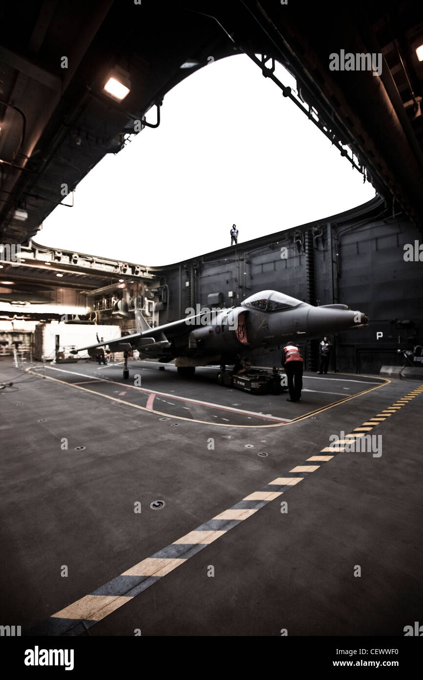 Harrier jet in naval aircraft carrier HMS Illustrius Stock Photo