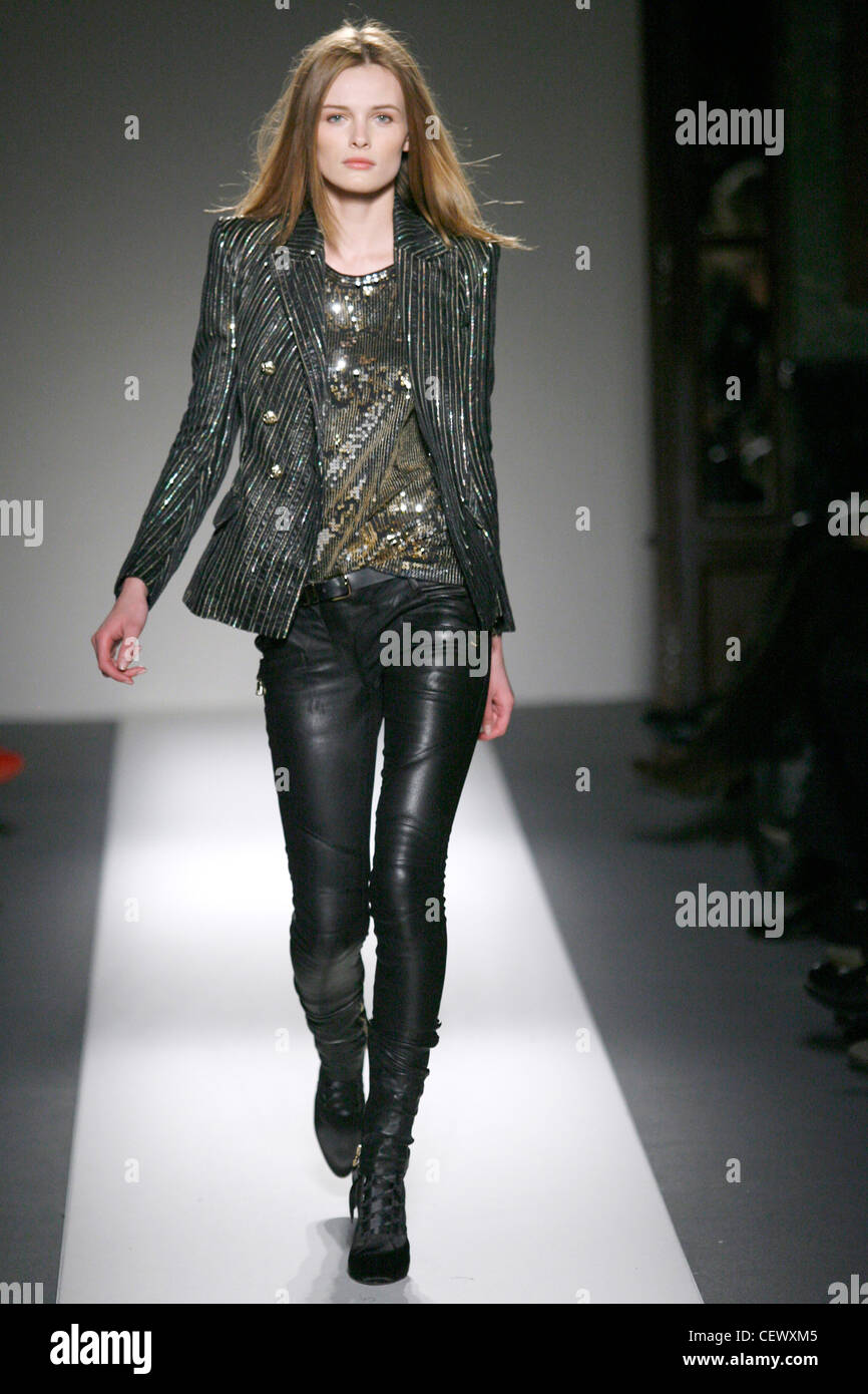 Balmain Paris Ready to Wear Autumn Winter Grey jacket, shiny patterned  sequin top, black leather trousers and black laced up Stock Photo - Alamy