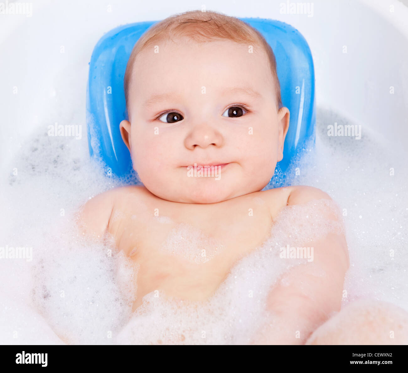 happy baby taking a bath with foam Stock Photo Alamy