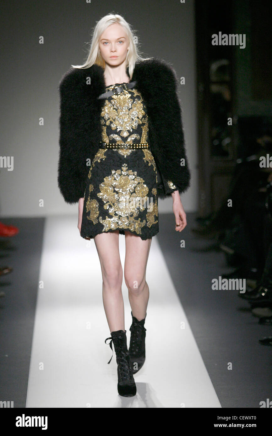 Balmain Paris Ready to Wear Autumn Winter Black short dress gold  embroidery, black fur jacket and black laced up ankle boots Stock Photo -  Alamy