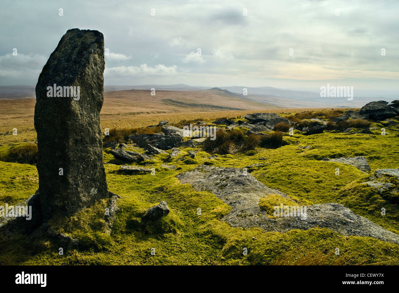 Standing stone and view to the south at Great Links Tor on Dartmoor, Devon Stock Photo