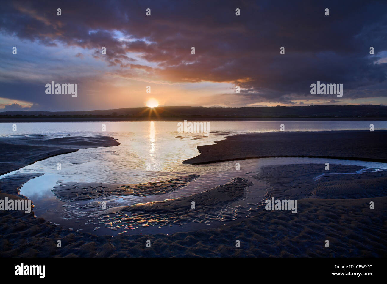 Sunset over mudflats of the River Severn at sunset. Stock Photo