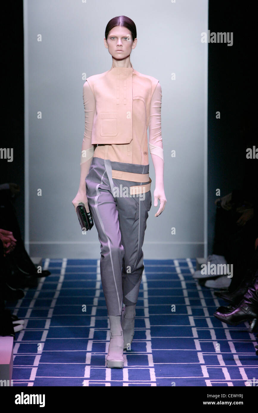 Balenciaga Paris Ready to Wear Spring Summer Model wearing grey and pale  pink twisted trouser jumpsuit a dropped waist and half Stock Photo - Alamy