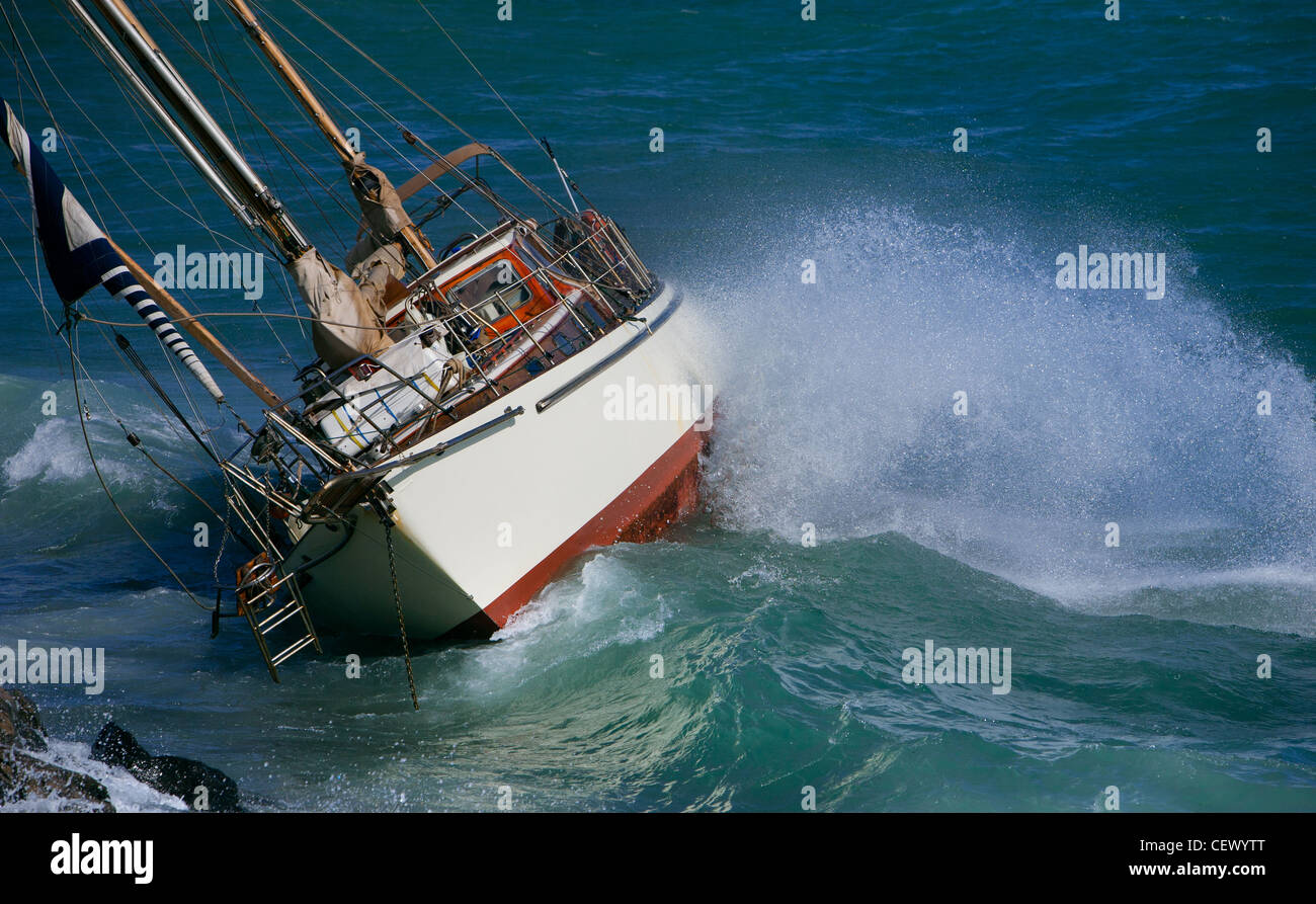 Ycanth Rash yacht crash on the rocks in stirmy weather Stock Photo - Alamy