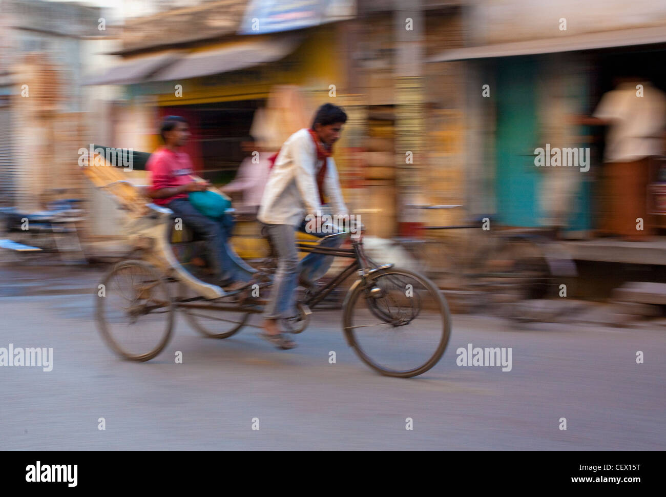 Rickshaw speeding past in Varanasi, India Stock Photo