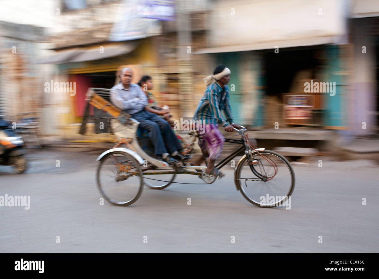 Rickshaw speeding past in Varanasi, India Stock Photo