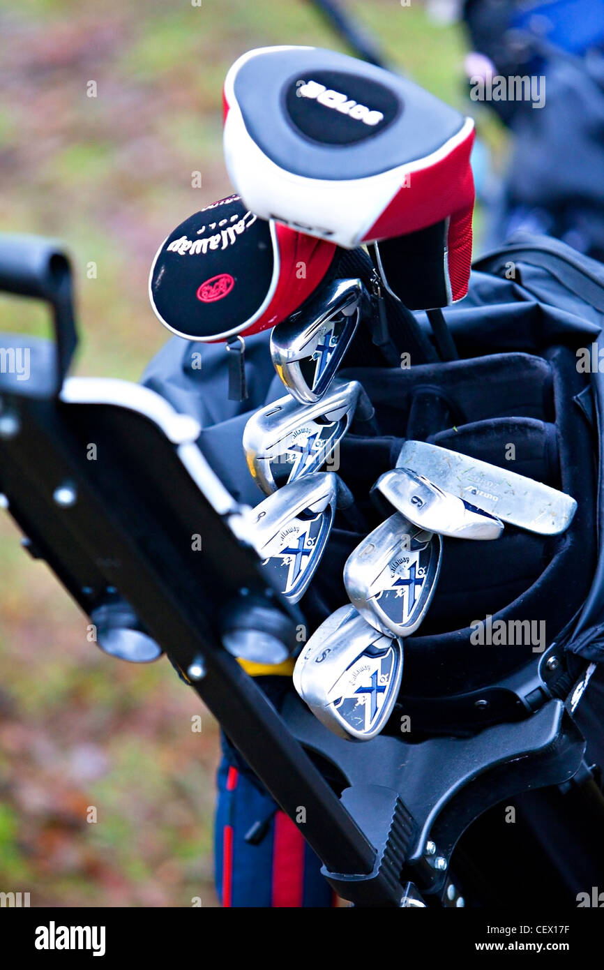 Golf clubs in trolley Stock Photo Alamy
