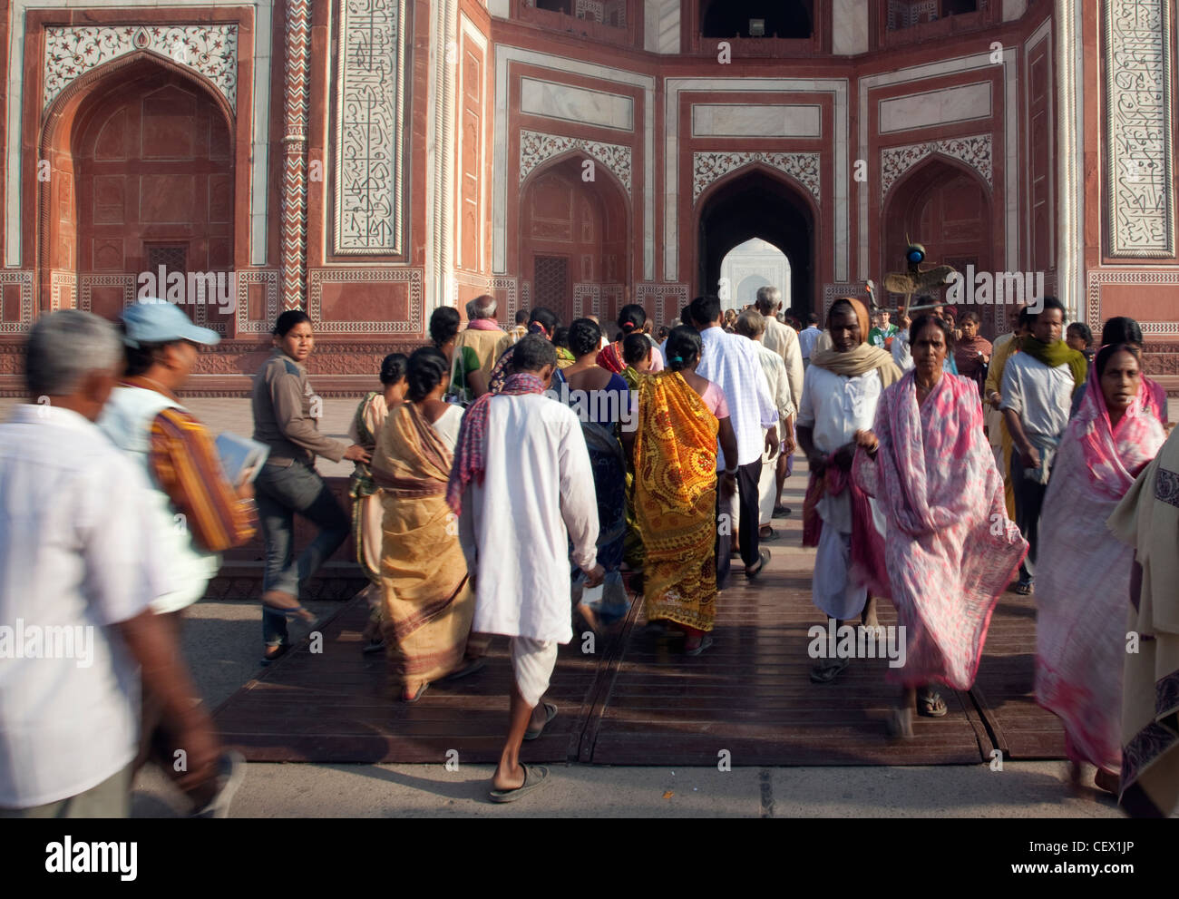 groups of people walking through the ground of the Taj Mahal, Agra, India Stock Photo