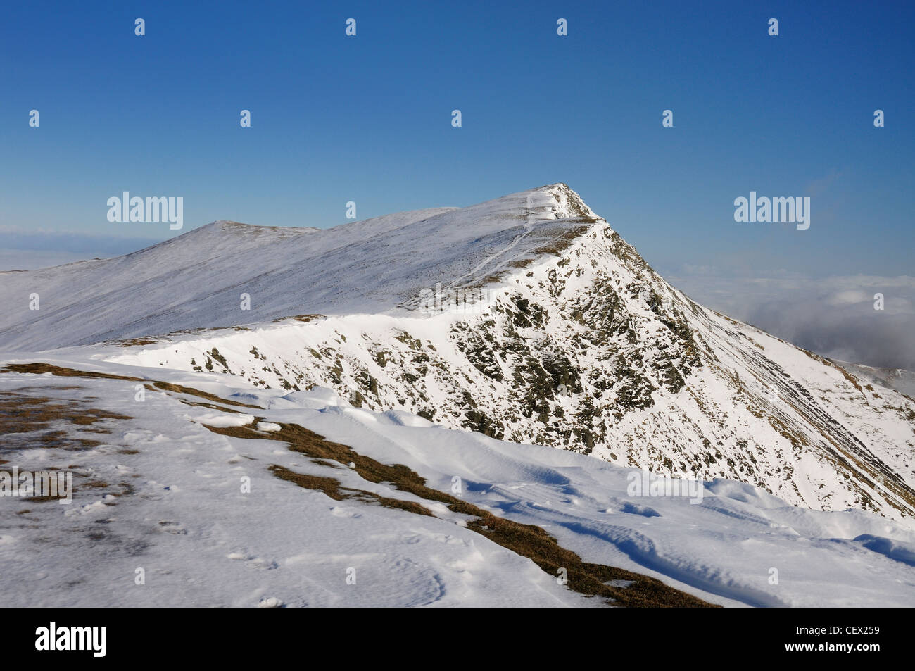 Blencathra summit ridge under blue sky in winter in the English Lake District Stock Photo