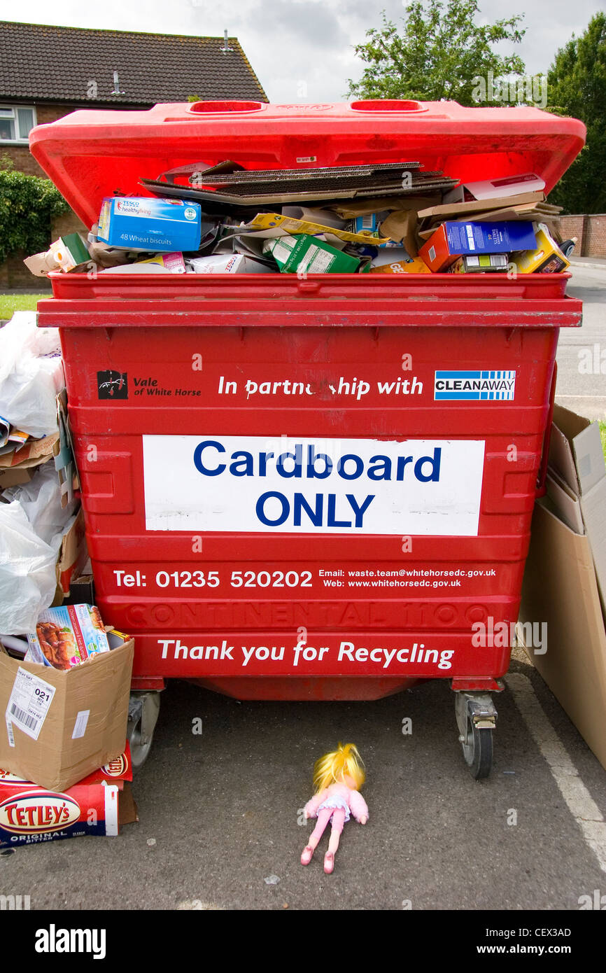 An overflowing waste re-cycling point on an Oxfordshire housing estate. Stock Photo