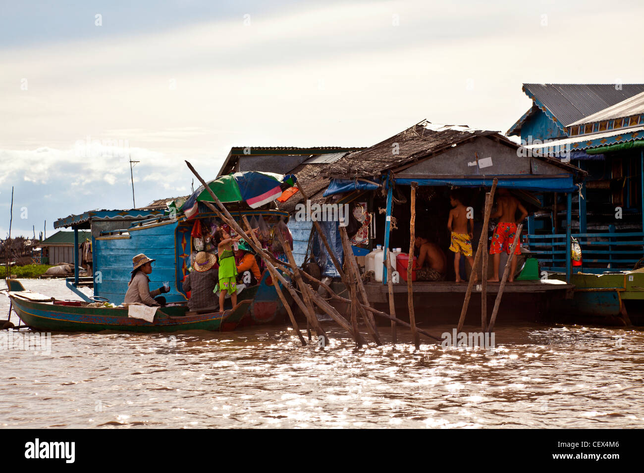People at a floating shop in a floating village on the Tonlé Sap lake near Siem Reap, Cambodia Stock Photo