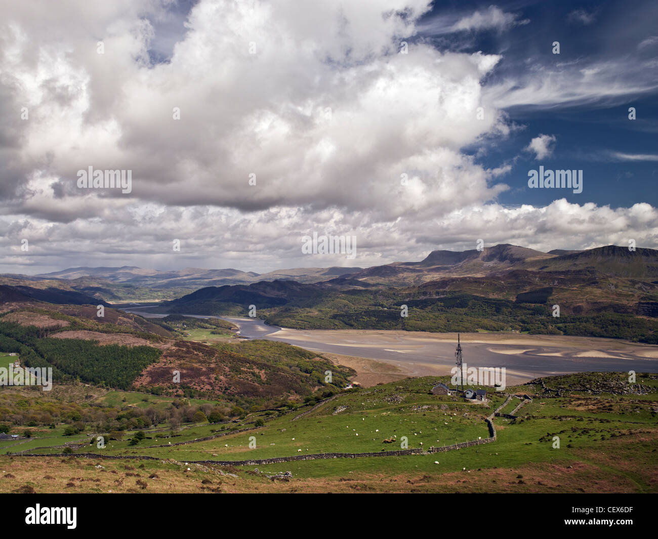 A telecommunications mast high on hills over-looking the Mawddach Estuary with a distant view to Cadair Idris. Stock Photo