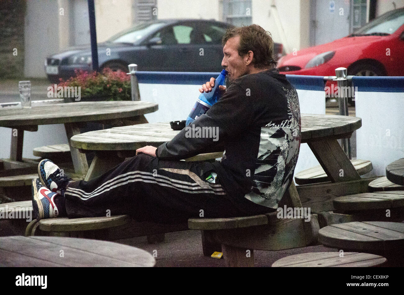 A man drinking cider in Falmouth, Cornwall Stock Photo