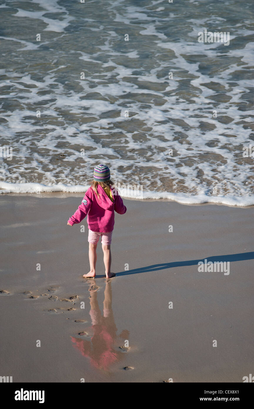 A young girl playing in the sea Stock Photo