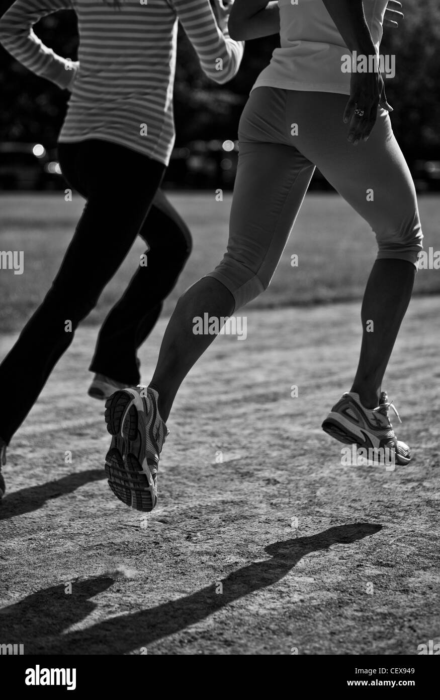 Runners in Regents Park running track Stock Photo