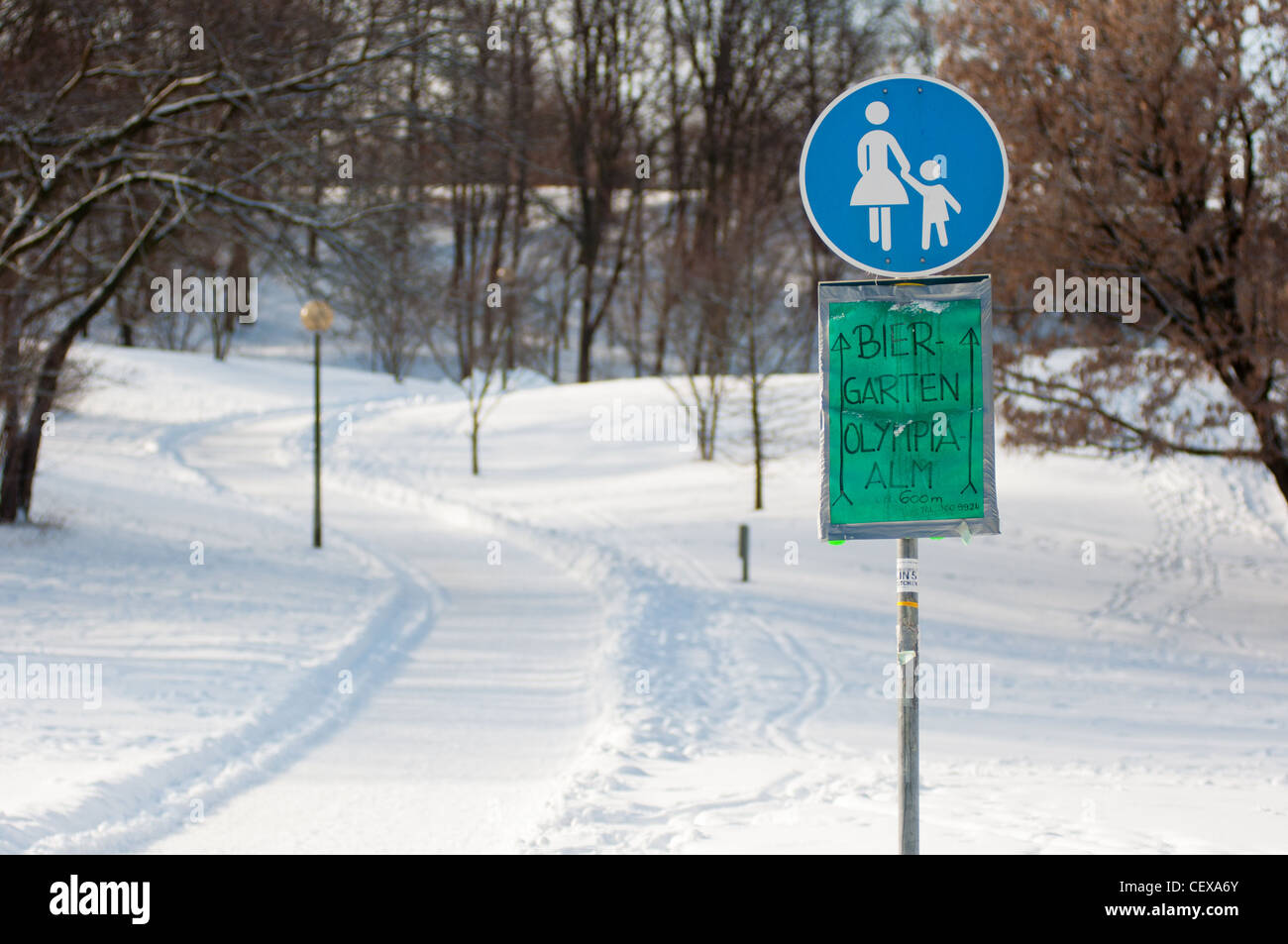 Path to where the beer is ice cold!  Sign showing the way to the beer garden at Munich's Olympic park in Germany. Stock Photo