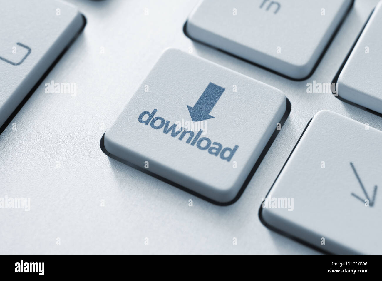 Download button on the keyboard. Toned Image. Stock Photo
