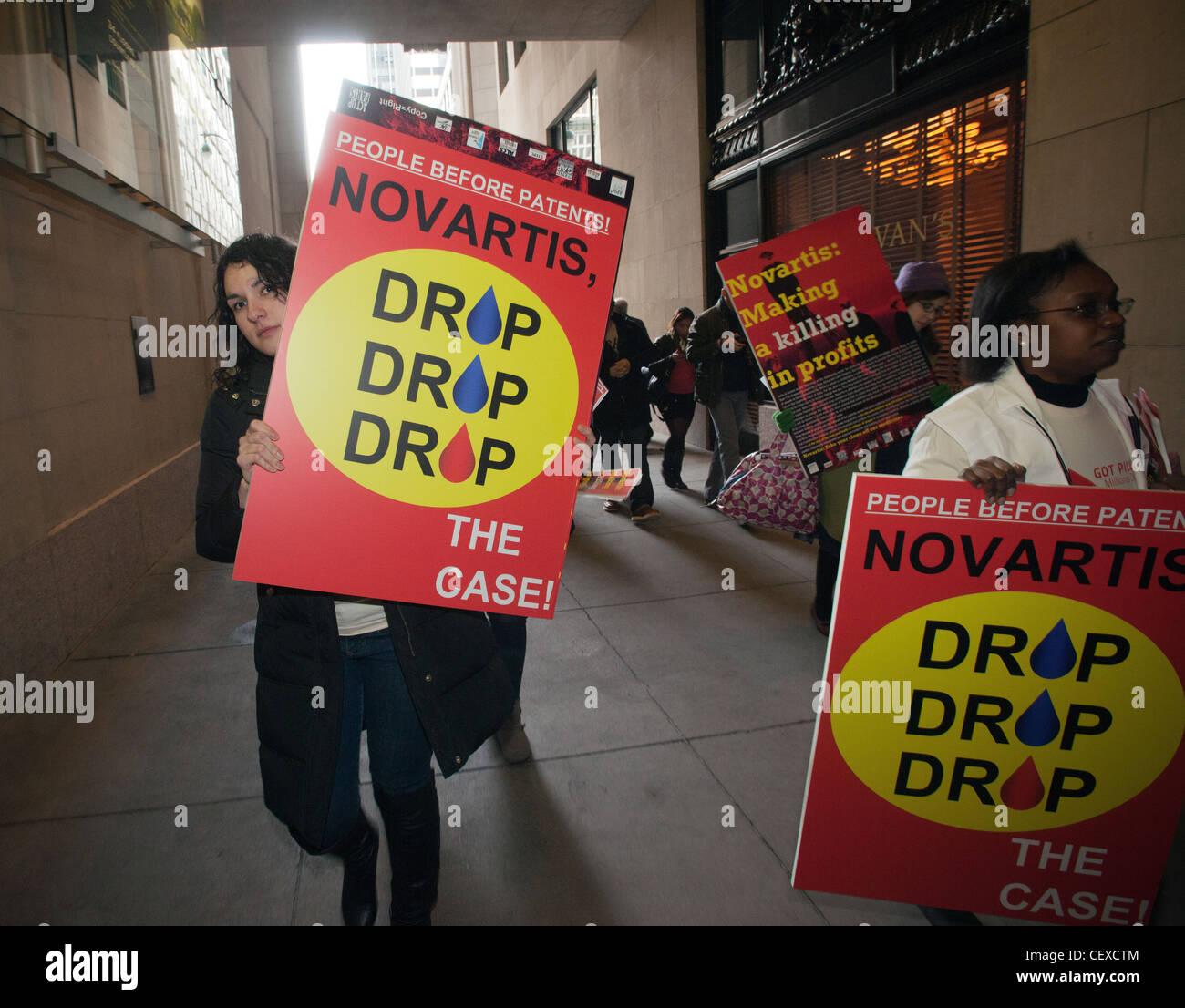 Volunteers from the group Doctors Without Borders protest in front of the offices of the Novartis drug company in New York Stock Photo