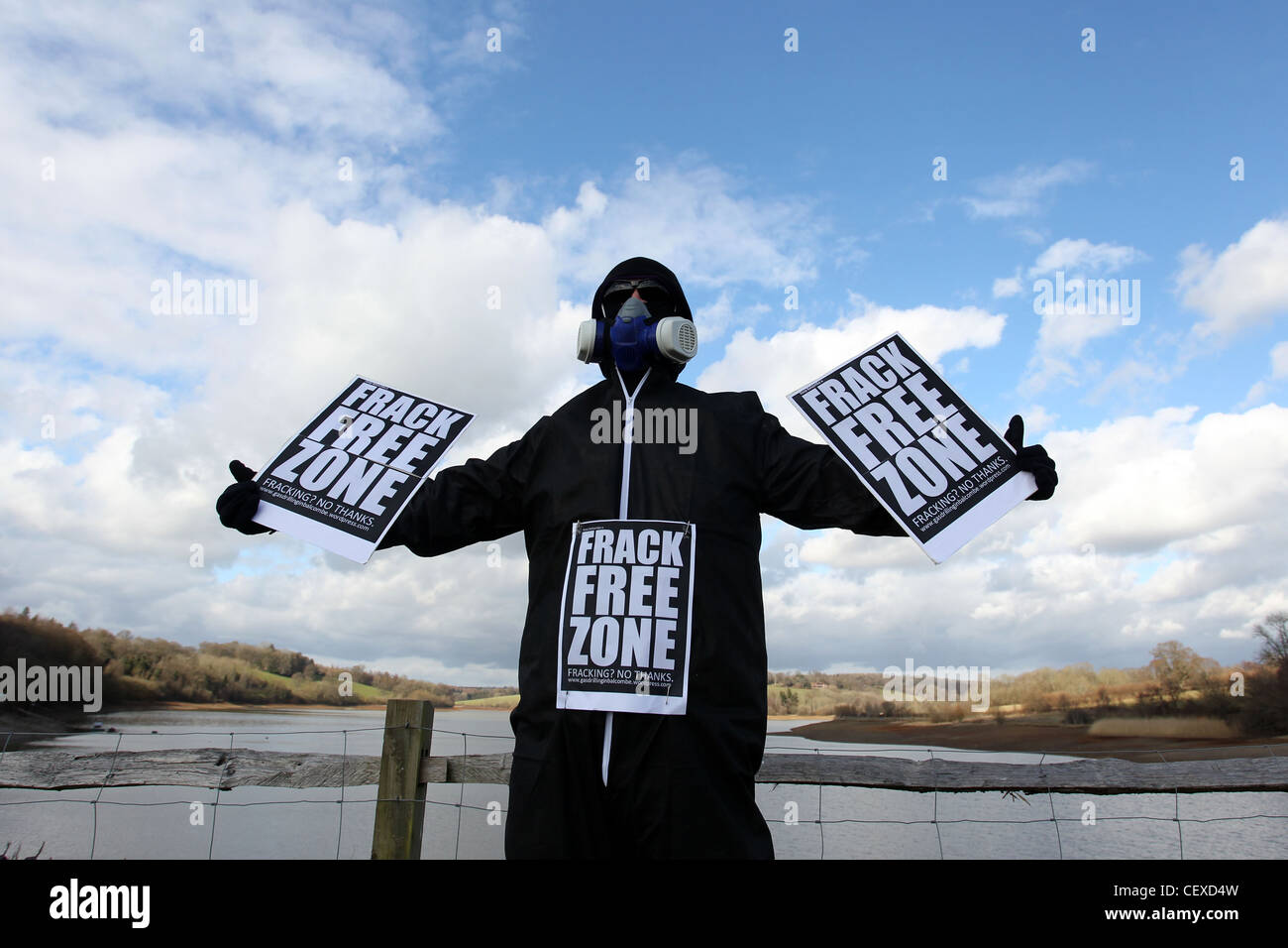 A masked man pictured protesting about the possibility of fracking taking place near Ardingly Reservoir, West Sussex, UK. Stock Photo