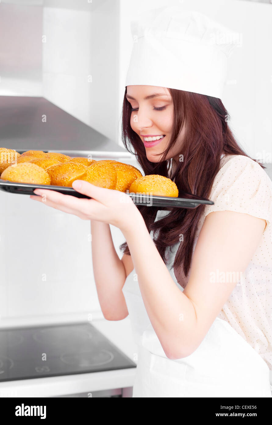 happy young woman baking bread at home Stock Photo - Alamy