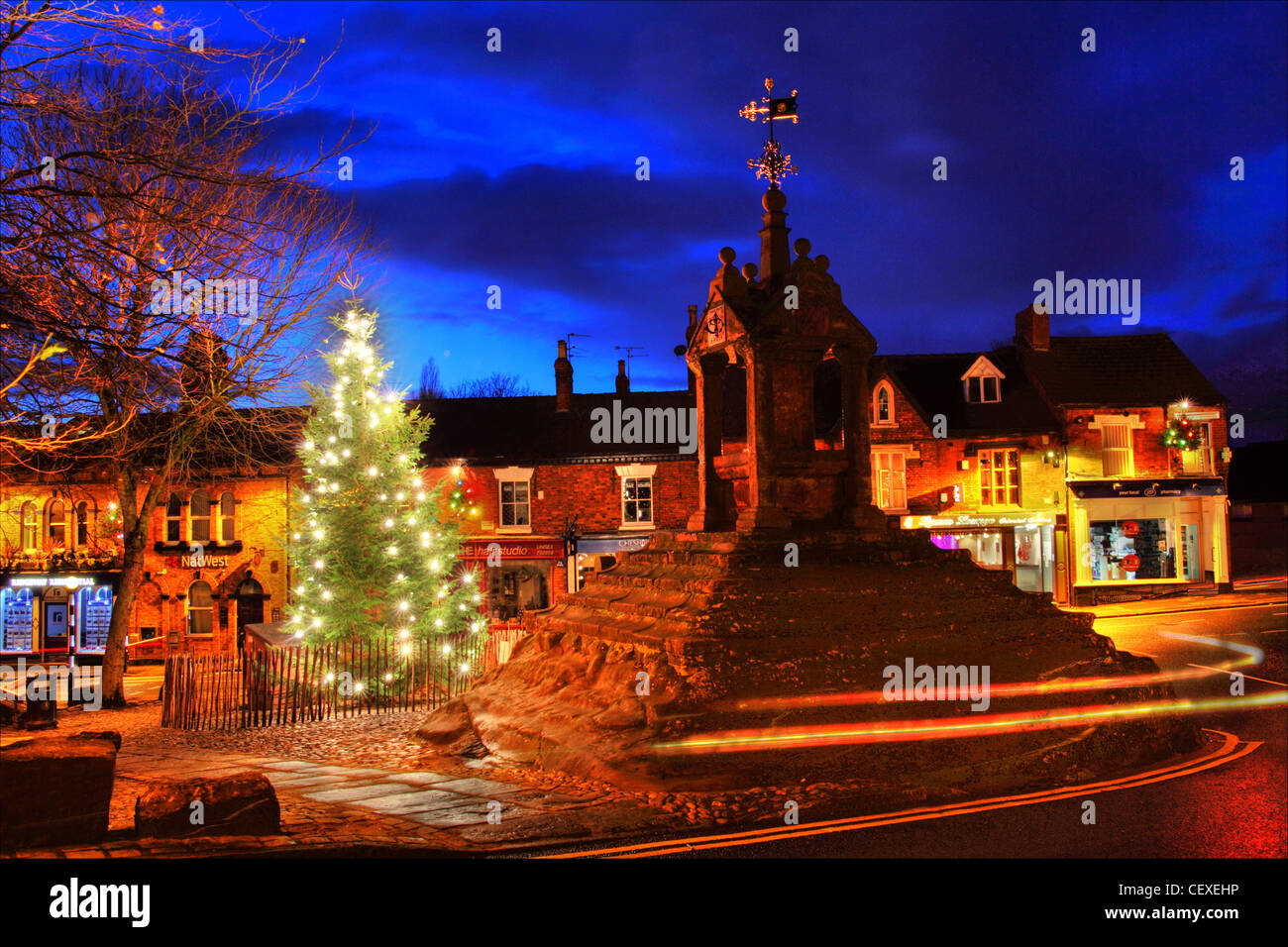 Xmas scene at the Christmas Tree at Lymm Cross, Lymm village, Cheshire, England, UK Stock Photo