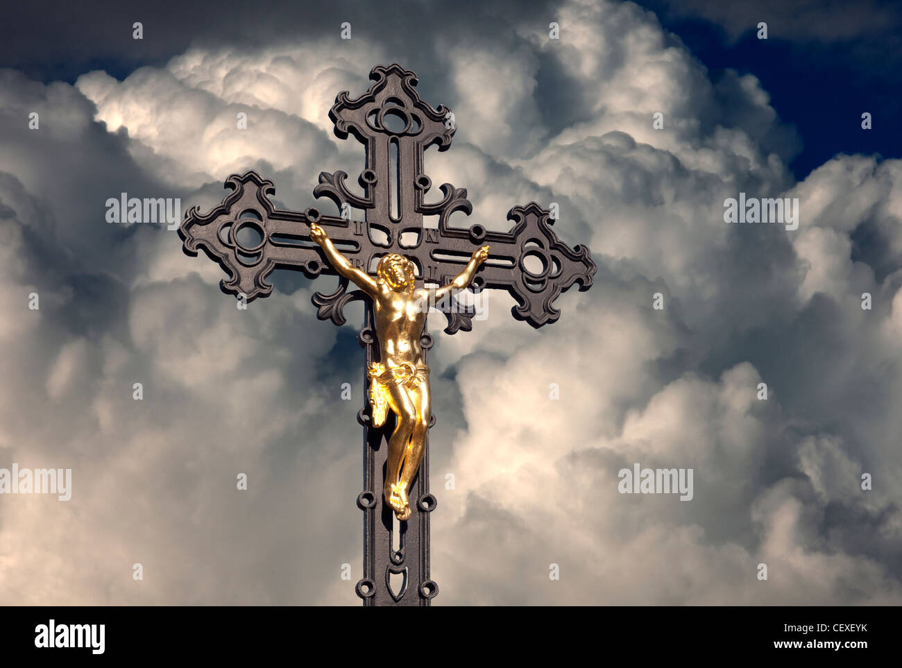 Jesus on the cross w stormy sky in the background Stock Photo