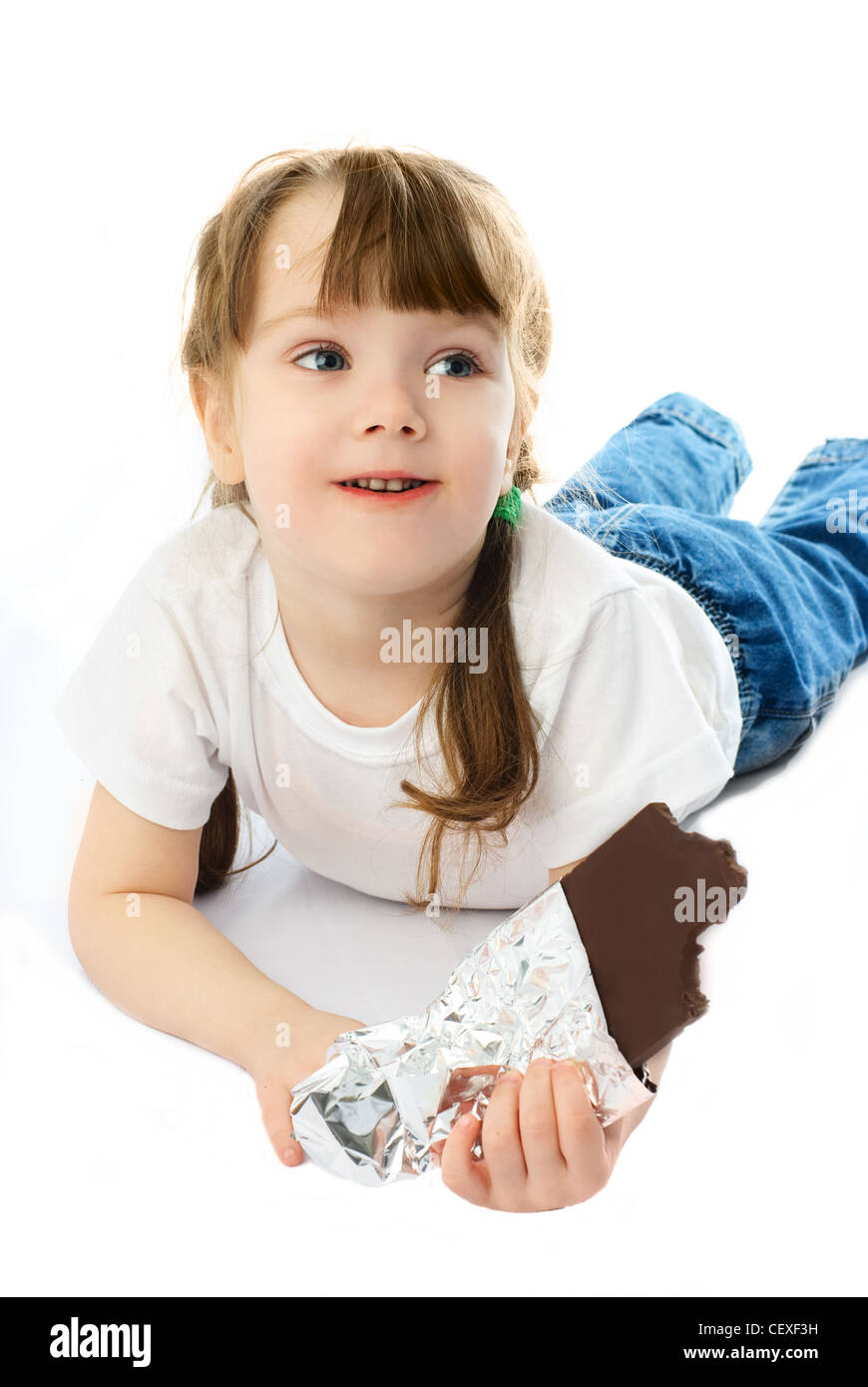 happy girl eating chocolate, isolated Stock Photo Alamy