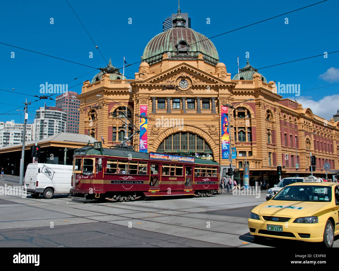 The City Circle tram passing Flinders Street Station Melbourne Australia Stock Photo