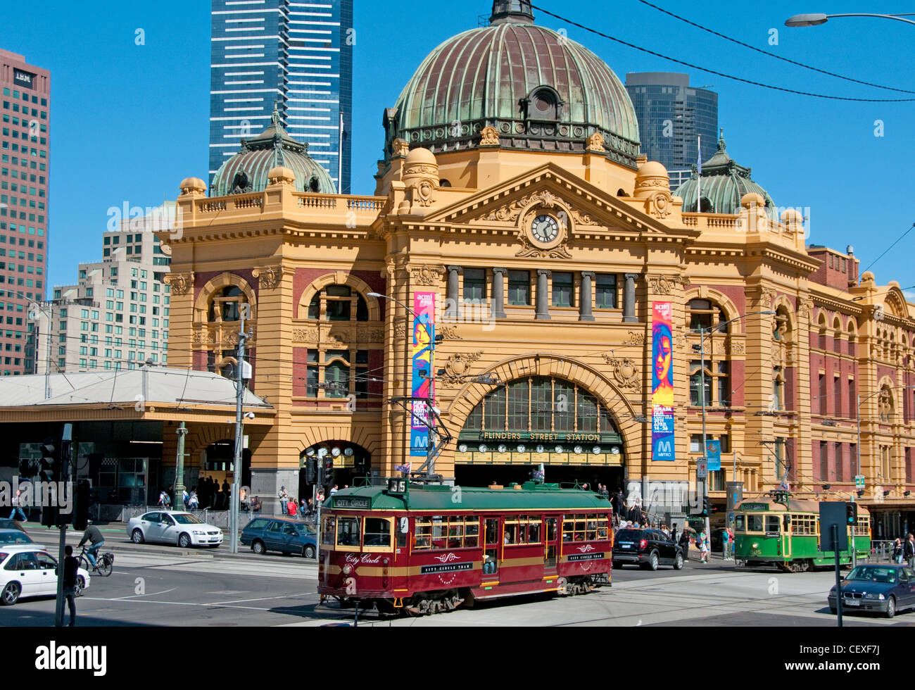 The City Circle tram passing Flinders Street Station Melbourne Australia Stock Photo