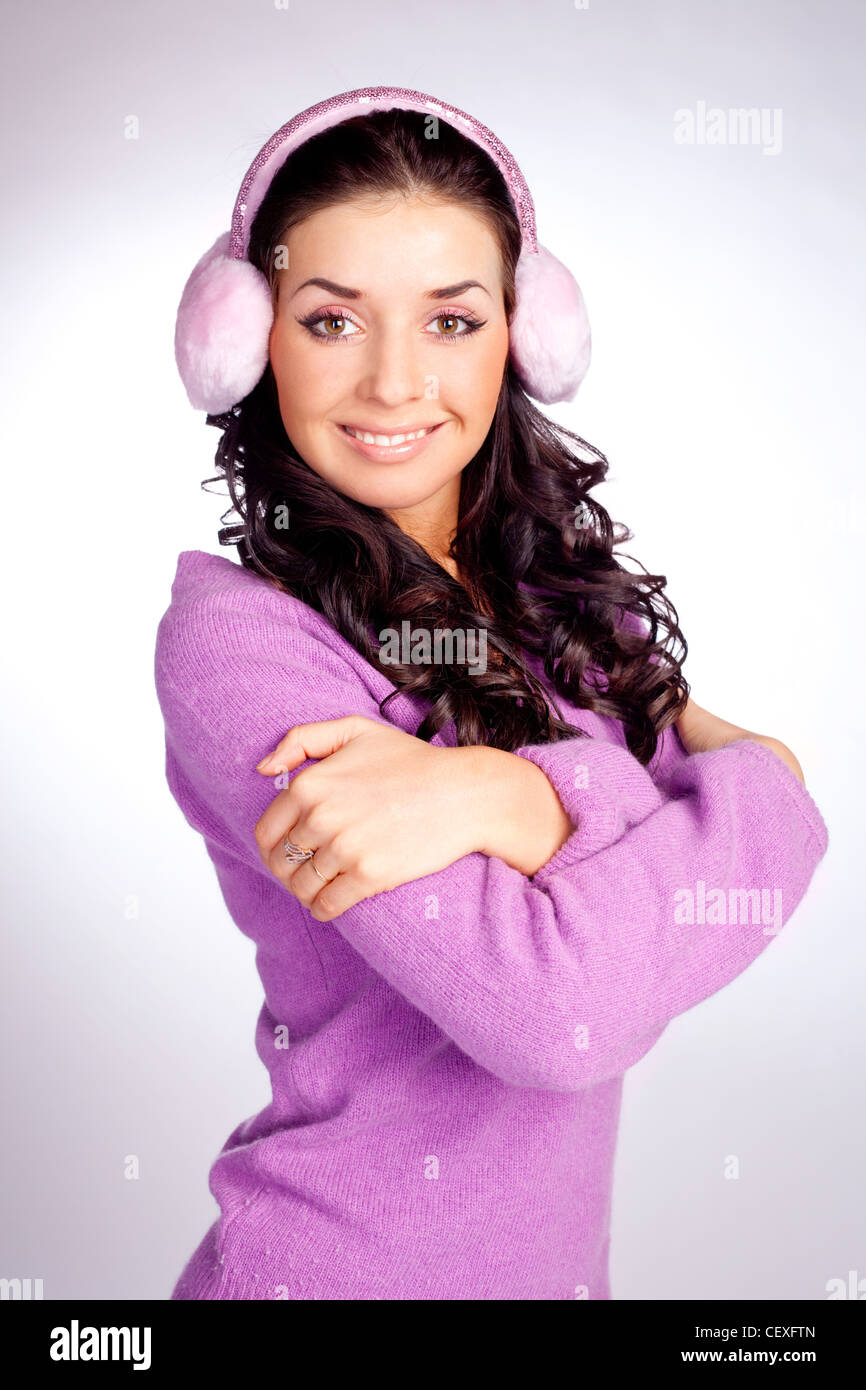 beautiful young woman wearing earmuff Stock Photo Alamy