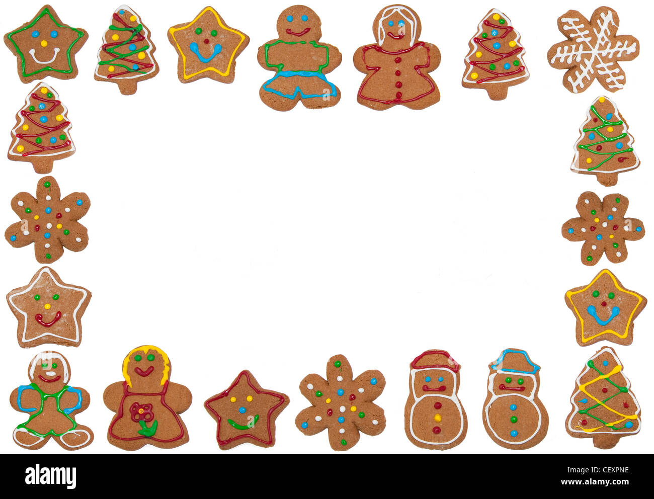 Frame of colorful gingerbread cookies on white, copy space in the middle Stock Photo
