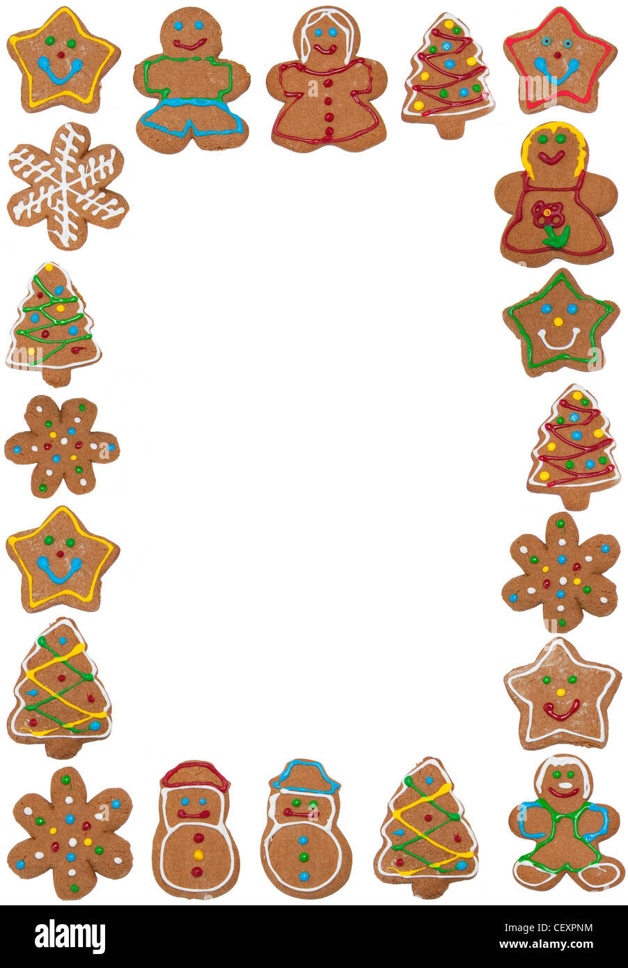 Vertical frame of colorful gingerbread cookies on white, copy space in the middle Stock Photo
