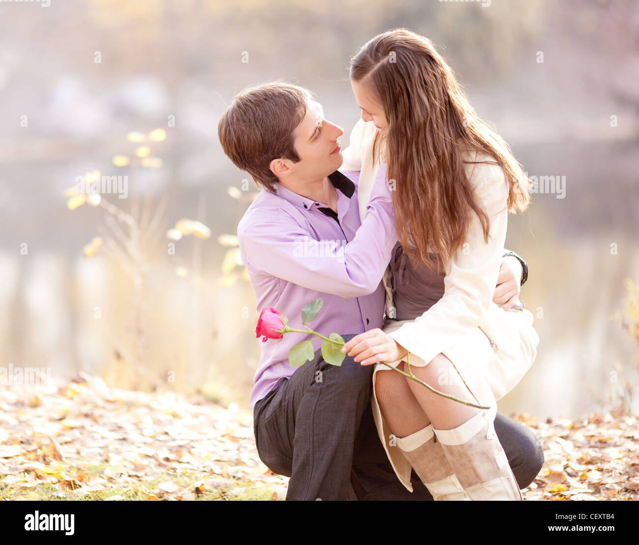 happy young couple in the park Stock Photo - Alamy