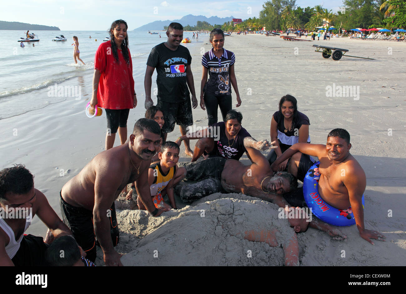 Group of friends on Cenang Beach. Stock Photo