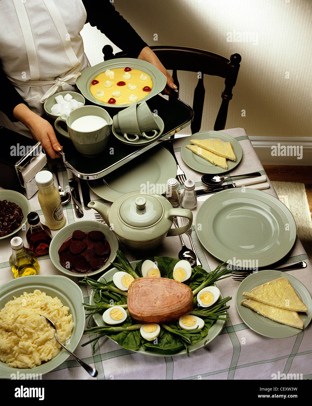 Cropped image of Female serving fifties food Stock Photo - Alamy