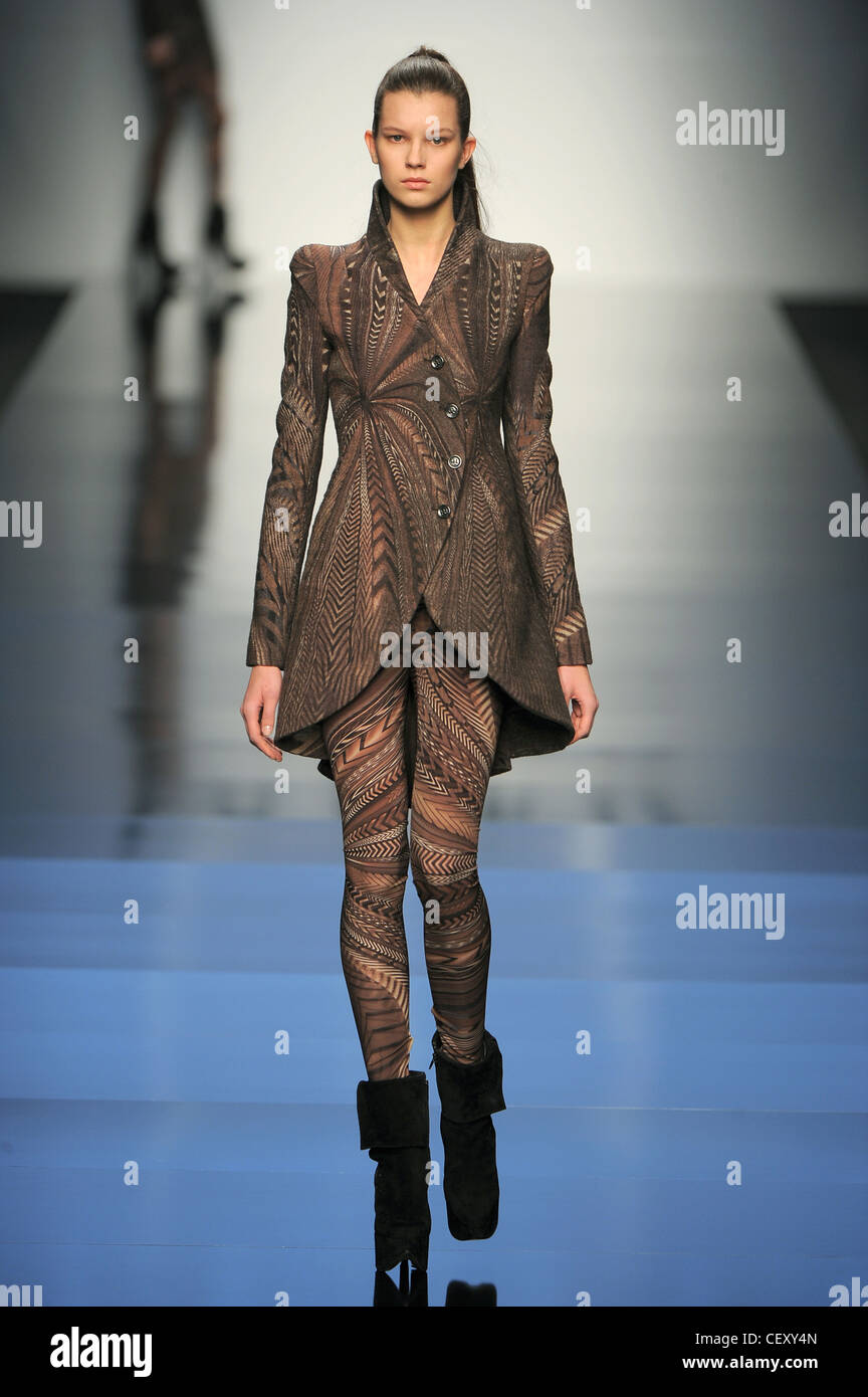 Byblos Milan Ready to Wear Autumn Winter Patterned single breasted structured coat, matching leggings and black ankle boots Stock Photo