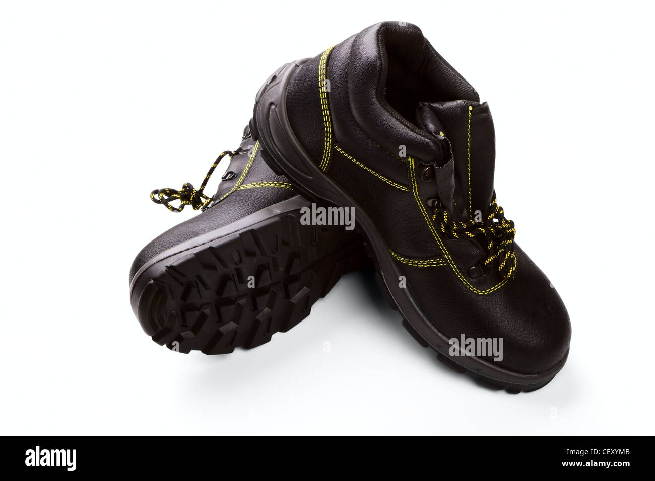 Working boots of black color with a yellow line isolated on a white background Stock Photo