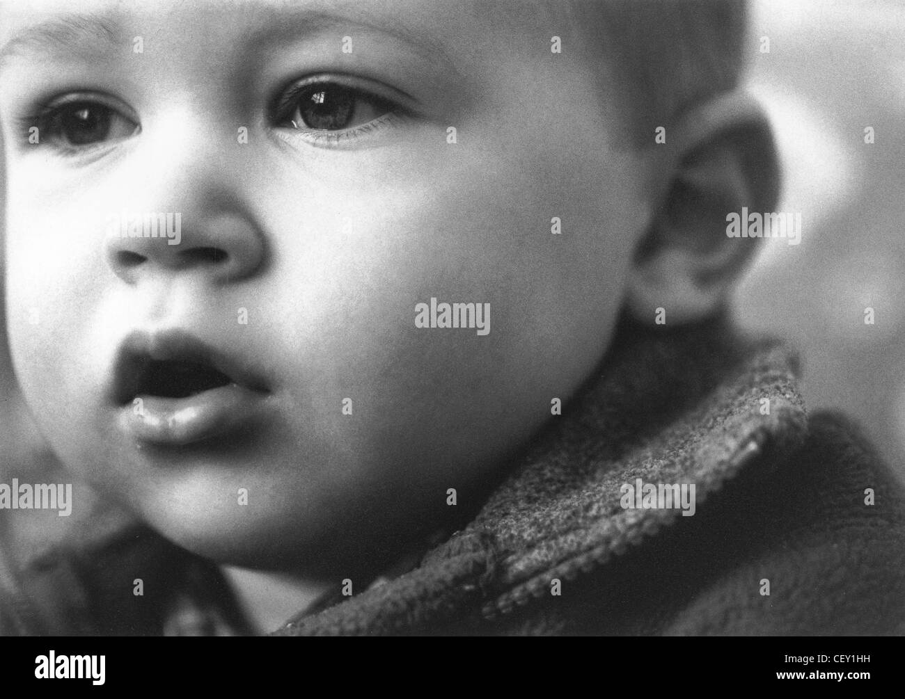 'FACES OF ALFI' Toddler with serious expression Stock Photo