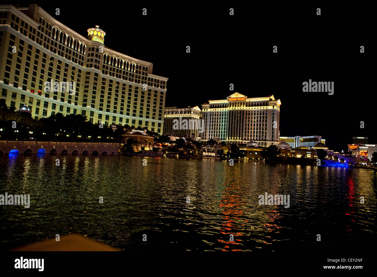 The Water Light show at the Bellagio in Las Vegas Nevada with Caesars Palace and the Strip in the Background Stock Photo