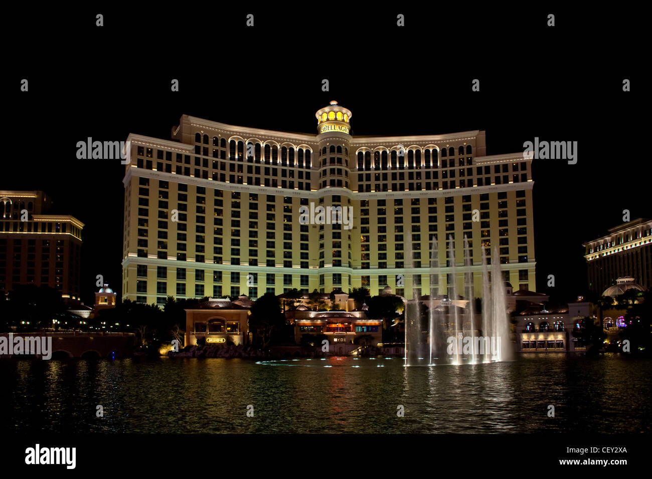 The Water Lightshow at the Bellagio in Las Vegas Nevada with Caesars Palace and the Strip in the Background Stock Photo