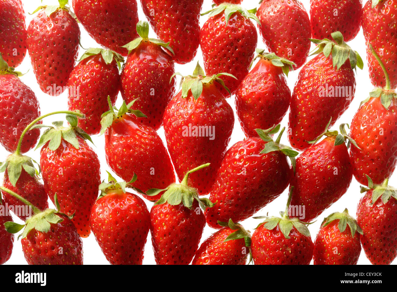Pattern of red ripe strawberries on white background Stock Photo